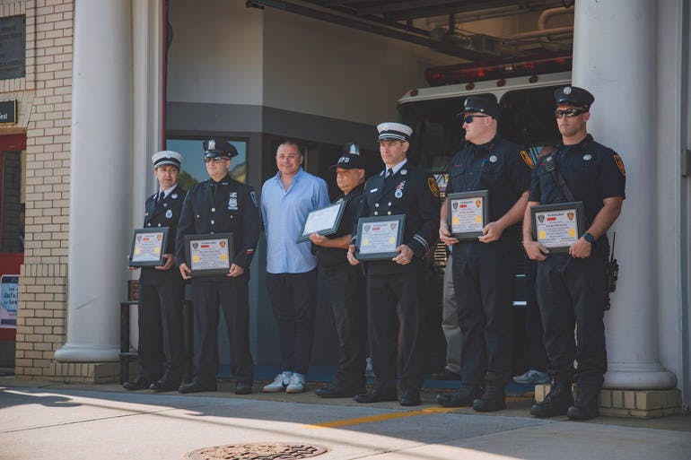 Photo Credit: Tyler Brown - Right to left: Fire Captain John Gura, Officer Ryan Weiss, Michele Berardi, Officer Donald Perkins, Fire Captain Louis Cerchio, Firefighter Ryan Dullea and Firefighter Patrick Carey. May 29, 2023.