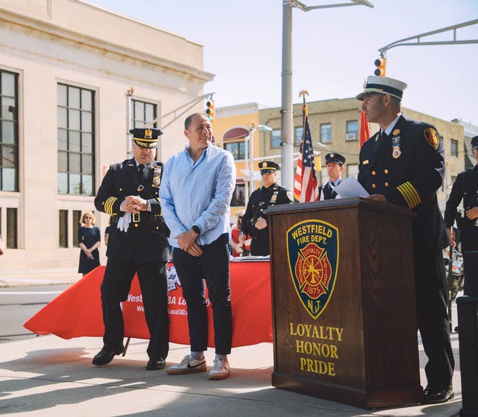 Photo Credit: Tyler Brown - Michele Berardi (middle), stands with Police Chief Christopher Battiloro and Fire Chief Michael Duelks. Berardi helped to present the Life Saving Awards to six first responders. May 29, 2023.